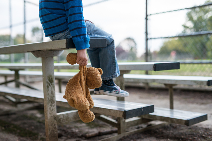Boy holding teddy bear